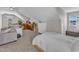 Spacious bonus room with a couch, desk, and bedroom area with carpeted floors at 3119 Guiding Light Rd, Raleigh, NC 27610