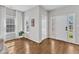 Welcoming entryway with hardwood floors, natural light, and a view of the neighborhood at 3119 Guiding Light Rd, Raleigh, NC 27610