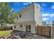 This is the exterior of this two-story home featuring a backyard, patio, and fence at 3119 Guiding Light Rd, Raleigh, NC 27610