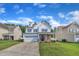 Inviting two-story home featuring a two-car garage, well-kept lawn, and classic curb appeal at 3119 Guiding Light Rd, Raleigh, NC 27610