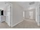 Hallway showing access to the bedroom, bathroom, and closet; the floor is carpeted at 3119 Guiding Light Rd, Raleigh, NC 27610