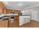 Spacious kitchen with wood cabinets, stainless steel appliances, and an open layout at 3119 Guiding Light Rd, Raleigh, NC 27610
