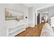 Bright living room featuring hardwood floors, modern decor, and ample natural light at 3119 Guiding Light Rd, Raleigh, NC 27610
