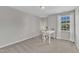 Home office features window with natural light, neutral walls, and plush carpet at 3119 Guiding Light Rd, Raleigh, NC 27610