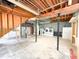 Unfinished basement laundry area, with exposed ceiling and support beams at 3323 Baugh St, Raleigh, NC 27604