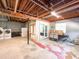 Basement featuring laundry area, framed room with French door, and space for storage at 3323 Baugh St, Raleigh, NC 27604