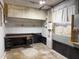 Unfinished basement featuring concrete walls and flooring, with utility connections, and work desk at 3323 Baugh St, Raleigh, NC 27604