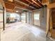 Large unfinished basement area with overhead garage door and access door to the exterior at 3323 Baugh St, Raleigh, NC 27604