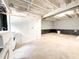 Unfinished basement area featuring concrete flooring and white walls at 3323 Baugh St, Raleigh, NC 27604