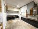 Unfinished basement featuring concrete walls and flooring, with utility connections and electrical box at 3323 Baugh St, Raleigh, NC 27604