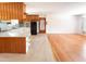 The kitchen boasts ample storage and seamless transition to living area at 3323 Baugh St, Raleigh, NC 27604