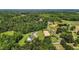 Wide aerial shot showing the horse property layout, featuring the arena, barn, and surrounding landscape at 3511 Corbett Rd, Mebane, NC 27302
