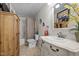 Well-lit bathroom with updated vanity, faucet and fixtures with a shower and toilet at 3511 Corbett Rd, Mebane, NC 27302