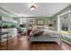 Well-lit bedroom with desk, aquarium, hardwood floors and neutral wall color at 3511 Corbett Rd, Mebane, NC 27302