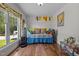 Bright bedroom with hardwood floors, large window, and whimsical wall decor at 3511 Corbett Rd, Mebane, NC 27302