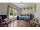 Cozy bedroom featuring hardwood floors, large window, and playful decor at 3511 Corbett Rd, Mebane, NC 27302