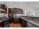 Modern kitchen with granite counters, stainless steel appliances, and plenty of cabinet storage at 3511 Corbett Rd, Mebane, NC 27302