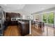 Stylish kitchen featuring granite countertops, dark wood cabinets, and a spacious breakfast nook at 3511 Corbett Rd, Mebane, NC 27302