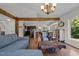 Inviting living room with open layout, hardwood floors, and a view into the kitchen at 3511 Corbett Rd, Mebane, NC 27302
