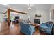 Open-concept living room with hardwood floors, vaulted ceiling, fireplace, and comfortable seating, perfect for relaxing at 3511 Corbett Rd, Mebane, NC 27302