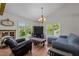 Comfortable living room featuring hardwood floors, natural light, and vaulted ceilings at 3511 Corbett Rd, Mebane, NC 27302