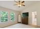 Light bedroom featuring large windows, modern furnishings and an ensuite bathroom entrance at 3610 Long Ridge Rd, Durham, NC 27703