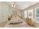 Bright bedroom features light wood furnishings, ceiling fan and great natural light at 3610 Long Ridge Rd, Durham, NC 27703