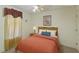 Standard bedroom featuring a bed dressed in orange linens and a matching window treatment at 3610 Long Ridge Rd, Durham, NC 27703