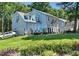 Charming two-story home, with a side entry garage, surrounded by lush green lawn and mature trees at 3610 Long Ridge Rd, Durham, NC 27703