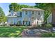 Charming two-story home with a well-manicured lawn and beautiful landscaping, great curb appeal at 3610 Long Ridge Rd, Durham, NC 27703