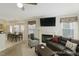 Inviting living room featuring a fireplace, a comfortable sofa, and an adjacent dining area at 3610 Long Ridge Rd, Durham, NC 27703