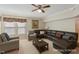 Comfortable living room featuring a plush sectional sofa, neutral walls, and a ceiling fan at 3610 Long Ridge Rd, Durham, NC 27703