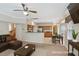 Open-concept living space with a kitchen, dining area, comfortable seating, and a neutral color palette at 3610 Long Ridge Rd, Durham, NC 27703