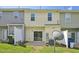 Townhome backyard features a patio and a lawn space perfect for outdoor enjoyment at 3973 Volkswalk Pl, Raleigh, NC 27610