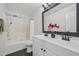 Well-lit bathroom featuring a double sink vanity, a shower-tub combo, and neutral decor at 3973 Volkswalk Pl, Raleigh, NC 27610