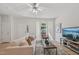 Comfortable living room with natural light, ceiling fan, and an open layout at 3973 Volkswalk Pl, Raleigh, NC 27610