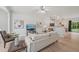 Open-concept living room with modern decor, white walls, hardwood floors, and a kitchen view at 3973 Volkswalk Pl, Raleigh, NC 27610