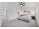 Spacious primary bedroom with neutral tones, a ceiling fan, and ample natural light at 3973 Volkswalk Pl, Raleigh, NC 27610