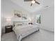 Bright primary bedroom features a ceiling fan, natural light, and tasteful decor at 3973 Volkswalk Pl, Raleigh, NC 27610