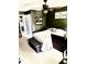 Comfortable bedroom with dark green walls, carpet, ceiling fan, and a comfortable bed at 4117 Mangrove Dr, Raleigh, NC 27616