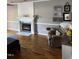 Comfortable living room with hardwood floors, an electric fireplace, and neutral decor at 4117 Mangrove Dr, Raleigh, NC 27616