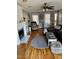 Cozy living room features hardwood floors, a fireplace, neutral decor, and a ceiling fan at 4117 Mangrove Dr, Raleigh, NC 27616