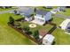 Aerial view showing home with a fenced backyard, stone fire pit, and a detached garage at 413 Hallie Long Ln, Burlington, NC 27217