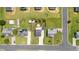 Wide aerial view of the neighborhood featuring a home with a large manicured lawn, storage shed, and privacy fence at 413 Hallie Long Ln, Burlington, NC 27217