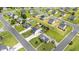 Wide aerial view of the neighborhood featuring a home with a large manicured lawn, storage shed, and privacy fence at 413 Hallie Long Ln, Burlington, NC 27217