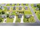 Wide aerial view of a home in the neighborhood with a large backyard featuring a fire pit and storage shed at 413 Hallie Long Ln, Burlington, NC 27217