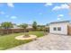 Backyard featuring manicured lawn, fire pit and patio, excellent for outdoor enjoyment and relaxation at 413 Hallie Long Ln, Burlington, NC 27217