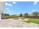 Spacious backyard featuring a fire pit, stone patio, and lawn, perfect for outdoor activities at 413 Hallie Long Ln, Burlington, NC 27217