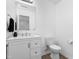 Clean bathroom with white vanity, ample storage, and a large mirror at 413 Hallie Long Ln, Burlington, NC 27217