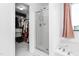 Bright bathroom featuring a glass enclosed shower, soaking tub, and walk-in closet for ultimate comfort at 413 Hallie Long Ln, Burlington, NC 27217